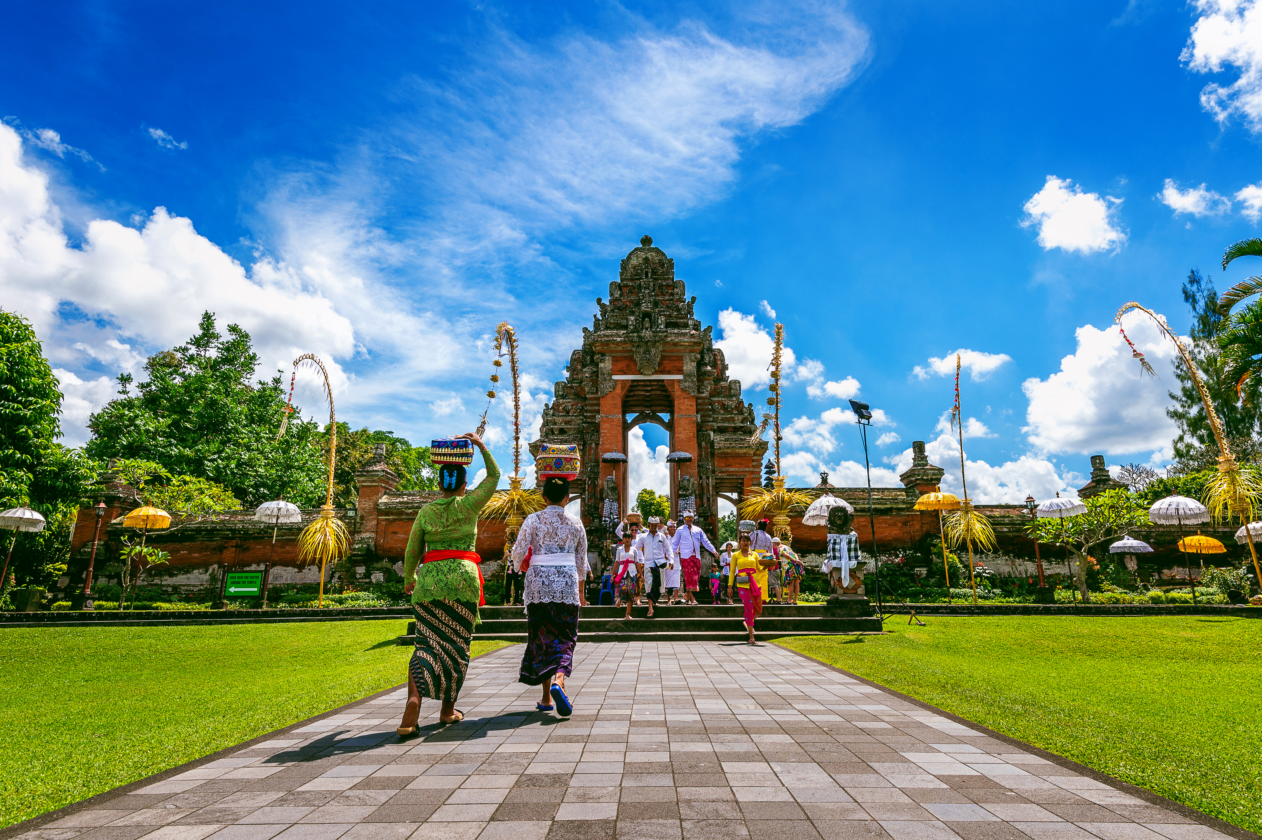1648624663-balinese-people-traditional-clothes-during-religious-ceremony-pura-taman-ayun-temple-bali-indonesia.jpg